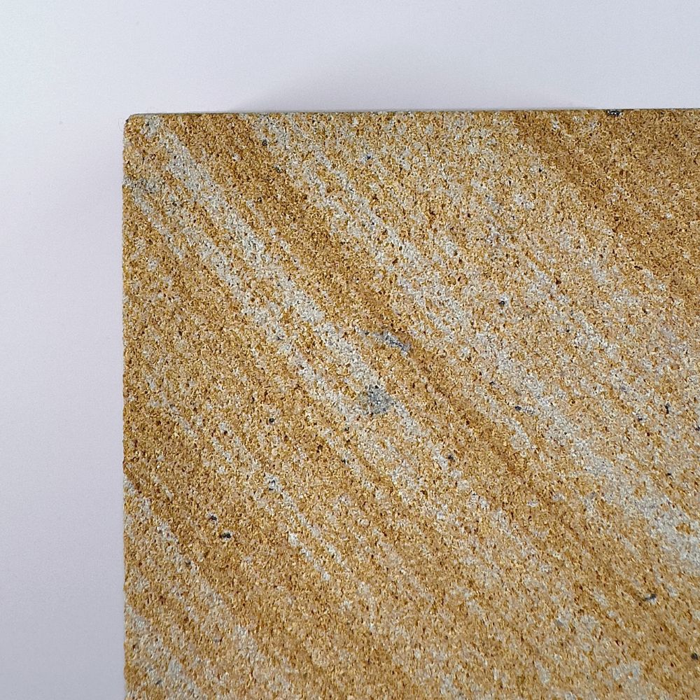 Banded 1 rck. refillable sandstone candle, side face close up of the sandstone