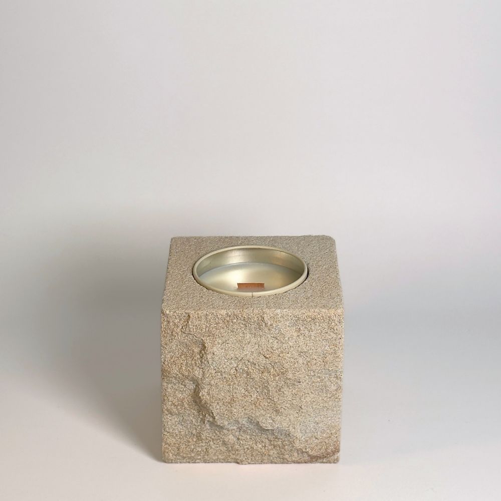 White rck. refillable sandstone candle with rock faced side shown on the front