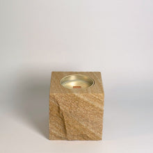 Beige 1 rck. refillable sandstone candle with rock faced side shown on the front