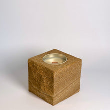 Brown rck. refillable sandstone candle with rock faced side shown on the left
