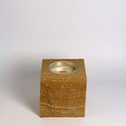 Brown rck. refillable sandstone candle with rock faced side shown on the front