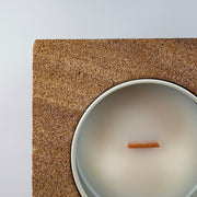 Earth brown rck. refillable sandstone candle, top face close up of the sandstone and soy candle