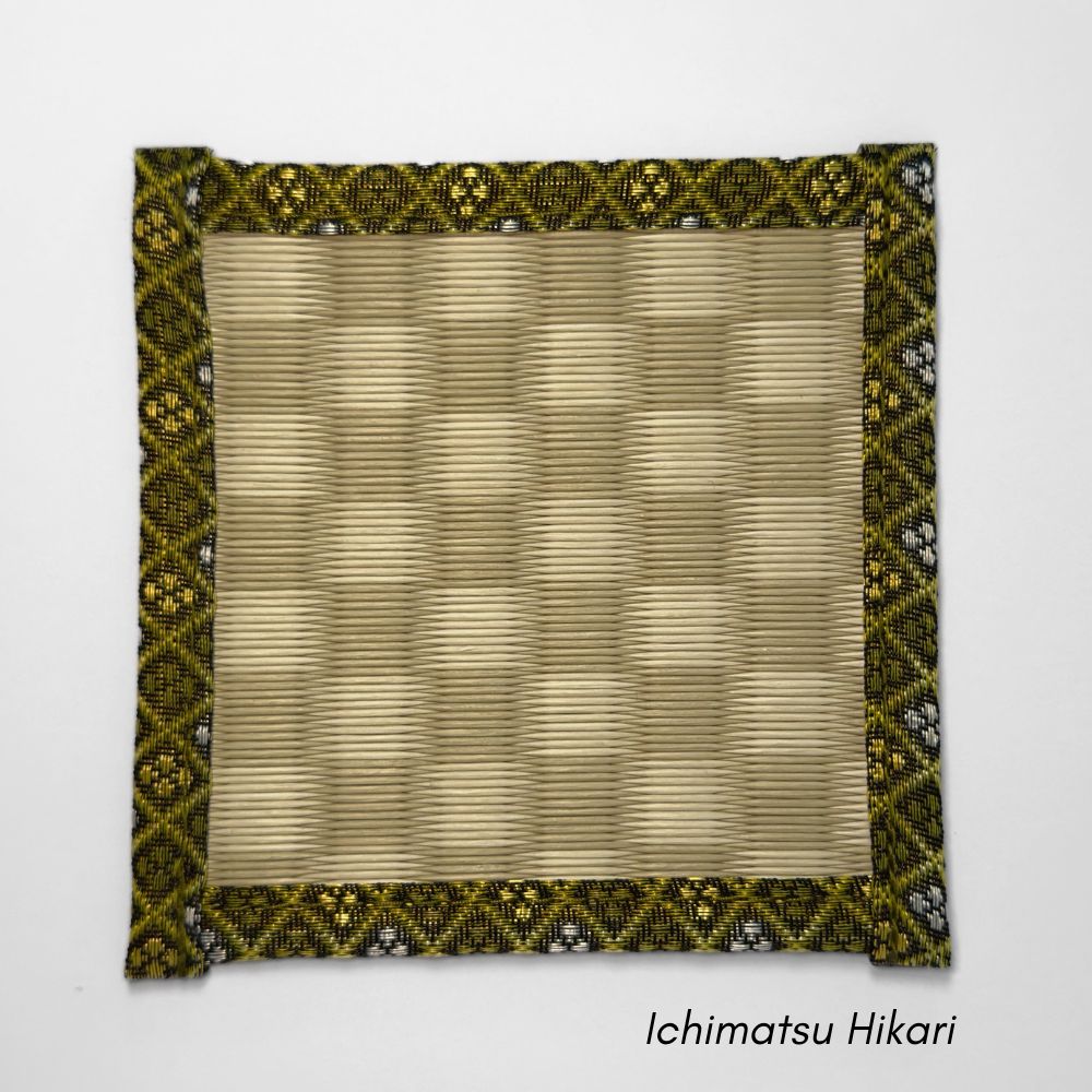 Square tatami coaster with a green and beige ichimatsu checkered pattern in the centre and a gold and olive patterned fabric border.