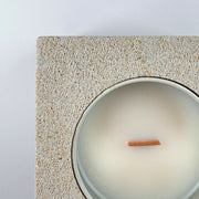 White rck. refillable sandstone candle, top face close up of the sandstone and soy candle