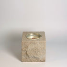 White rck. refillable sandstone candle with rock faced side shown on the front